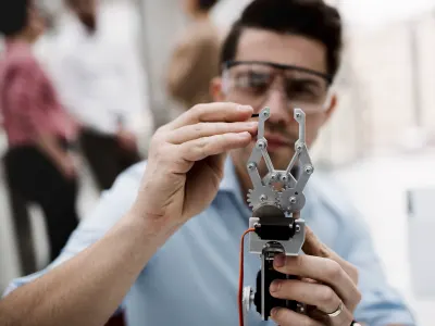 Guy working on a robotic hand